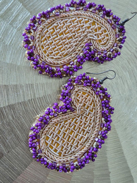 handmade earrings with golden embroidery and purple beads